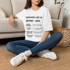 I Survived Life in Britain 2026 T-Shirt — Political Commentary Tee - Our Colours